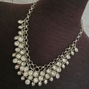Silvertone bib statement necklace with cascading clear rhinestones